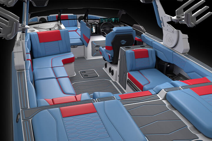 The spacious red and blue interior of an All-New 2025 Malibu Wakesetter 24 MXZ with gray Soft Grip Flooring